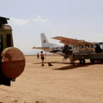 Private air charter flying over the Maasai Mara wildlife reserve in Kenya