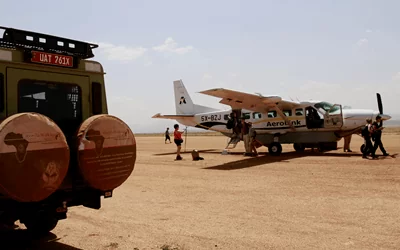 Private air charter flying over the Maasai Mara wildlife reserve in Kenya