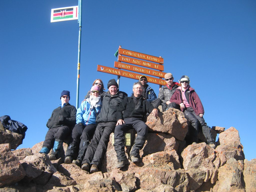 Climbers ascending Point Lenana on Mount Kenya at sunrise